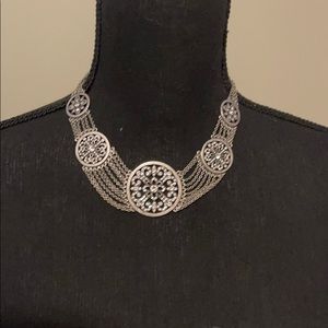 Silver necklace.